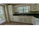 Kitchen featuring unique decor, tile countertops, and plenty of natural light at 345 Deerwood Dr, Suwanee, GA 30024