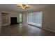 Spacious living room featuring a fireplace and natural light at 345 Deerwood Dr, Suwanee, GA 30024