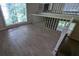 Bright living room with wood flooring and large windows at 345 Deerwood Dr, Suwanee, GA 30024