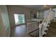 Open living room featuring natural light, staircase and contemporary finishes at 345 Deerwood Dr, Suwanee, GA 30024