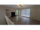 Spacious living room with fireplace and built in shelving at 345 Deerwood Dr, Suwanee, GA 30024