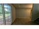 Living room with sliding glass doors to backyard at 345 Deerwood Dr, Suwanee, GA 30024