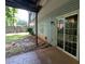 Exterior showing a patio with sliding doors and a small grassy area at 345 Deerwood Dr, Suwanee, GA 30024