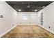 Spacious basement with ample potential, painted walls, and a walkout door at 6864 Maddox Rd, Morrow, GA 30260