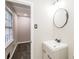 Bathroom with modern vanity, stylish faucet, and natural light from the window at 6864 Maddox Rd, Morrow, GA 30260