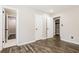 Light and airy bedroom with wood floors and multiple doors for easy access at 6864 Maddox Rd, Morrow, GA 30260