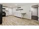 Spacious kitchen featuring white cabinets, granite countertops, and black appliances at 6864 Maddox Rd, Morrow, GA 30260