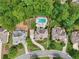 Aerial view of a beautiful neighborhood with lush greenery, well-maintained homes, and backyard pools at 1225 Elk Ridge Cv, Alpharetta, GA 30005