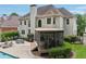 Back of home with an outdoor patio, dining set, screened in porch, and a beautiful pool at 1225 Elk Ridge Cv, Alpharetta, GA 30005