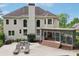 Exterior showcasing a spacious patio, lounge chairs, screened-in porch, and beautiful in-ground pool at 1225 Elk Ridge Cv, Alpharetta, GA 30005