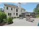 Outdoor living space with poolside seating, dining area, and access to a screened-in porch at 1225 Elk Ridge Cv, Alpharetta, GA 30005
