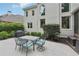 Back patio features an outdoor dining area with a grill for entertaining guests at 1225 Elk Ridge Cv, Alpharetta, GA 30005