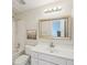 Well-lit bathroom featuring a vanity with a gold framed mirror and a separate tub/shower at 1225 Elk Ridge Cv, Alpharetta, GA 30005