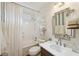 Cozy bathroom complete with shower-tub combo, vanity and decorative mirror at 1225 Elk Ridge Cv, Alpharetta, GA 30005