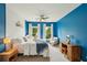 Inviting bedroom with blue walls, white shiplap, and large windows with view at 1225 Elk Ridge Cv, Alpharetta, GA 30005