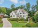 Charming two-story home with manicured landscaping and a beautiful, long driveway at 1225 Elk Ridge Cv, Alpharetta, GA 30005