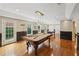 Large recreational room with pool table, air hockey table, and access to outdoor space at 1225 Elk Ridge Cv, Alpharetta, GA 30005