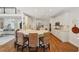 Open kitchen with eat in bar overlooking living area and equipped with stainless steel appliances at 1225 Elk Ridge Cv, Alpharetta, GA 30005