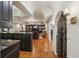 Finished basement with hardwood floors, an entertainment area, and a kitchen island at 1225 Elk Ridge Cv, Alpharetta, GA 30005