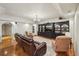 Cozy living room with recessed lighting, dark built-ins, and comfortable seating at 1225 Elk Ridge Cv, Alpharetta, GA 30005