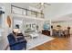 Open-concept living area with hardwood floors, tall ceilings, loft area, and seamless flow into the kitchen at 1225 Elk Ridge Cv, Alpharetta, GA 30005