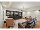 Spacious living room featuring a built-in entertainment center and recessed lighting at 1225 Elk Ridge Cv, Alpharetta, GA 30005