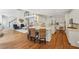 Open concept living space with modern kitchen and staircase at 1225 Elk Ridge Cv, Alpharetta, GA 30005