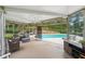 Outdoor patio with comfortable seating overlooking the backyard and pool at 1225 Elk Ridge Cv, Alpharetta, GA 30005