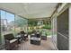 Covered outdoor patio with wicker furniture offering a relaxing space at 1225 Elk Ridge Cv, Alpharetta, GA 30005