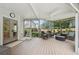 Relaxing screened-in porch with comfortable seating and serene views of the backyard at 1225 Elk Ridge Cv, Alpharetta, GA 30005