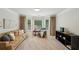 Sitting room area with cozy seating, natural light, and a modern aesthetic at 1225 Elk Ridge Cv, Alpharetta, GA 30005