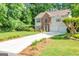 Traditional two-story home with brick accents, a well-manicured lawn, and a long driveway at 190 Crestworth Ct, Powder Springs, GA 30127