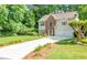 Charming two-story home with a well-manicured lawn, a two-car garage, and a long driveway at 190 Crestworth Ct, Powder Springs, GA 30127