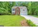 Traditional two-story home with brick accents and a well-manicured lawn and driveway at 190 Crestworth Ct, Powder Springs, GA 30127