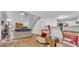 Cozy living room with wood floors, neutral walls, ceiling fan and adjacent kitchen bar at 190 Crestworth Ct, Powder Springs, GA 30127