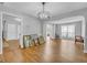 Open concept living room featuring hardwood floors and plentiful natural light at 190 Crestworth Ct, Powder Springs, GA 30127