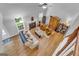 Aerial view of living room with fireplace, hardwood floors, and comfortable seating at 190 Crestworth Ct, Powder Springs, GA 30127