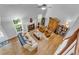 Bright and airy living room featuring wood floors, a fireplace, and lots of natural light at 190 Crestworth Ct, Powder Springs, GA 30127