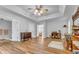 Spacious main bedroom with a ceiling fan, ample natural light, and wood floors at 190 Crestworth Ct, Powder Springs, GA 30127