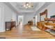 Spacious main bedroom with a tray ceiling, hardwood floors, and room for a seating area or office space at 190 Crestworth Ct, Powder Springs, GA 30127