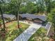 Aerial view of a modern home showcasing a lush lawn, long driveway, and meticulously maintained landscaping at 2648 Varner Ne Dr, Atlanta, GA 30345