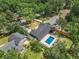 Expansive aerial view of a home featuring a backyard swimming pool and lush green surroundings at 2648 Varner Ne Dr, Atlanta, GA 30345