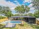 Beautiful backyard with a modern pool, a covered patio, and lush landscaping at 2648 Varner Ne Dr, Atlanta, GA 30345