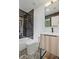 Modern bathroom featuring black tiled shower and stylish vanity with sleek fixtures and marble flooring at 2648 Varner Ne Dr, Atlanta, GA 30345