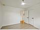 Simple bedroom showcasing gray floors, a ceiling fan, and closet doors at 2648 Varner Ne Dr, Atlanta, GA 30345