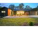 Contemporary home exterior boasting dark siding, large windows and a well-manicured lawn at 2648 Varner Ne Dr, Atlanta, GA 30345