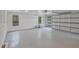 Spacious, clean garage interior featuring bright lighting, ample room for parking and storage, and side entry door at 2648 Varner Ne Dr, Atlanta, GA 30345