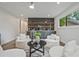 Open living room featuring a custom bar with mini fridge, open shelves and stylish seating at 2648 Varner Ne Dr, Atlanta, GA 30345