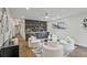 Contemporary living space featuring custom bar, stylish seating, and hardwood floors at 2648 Varner Ne Dr, Atlanta, GA 30345