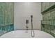 Close-up of the elegant tub in the main bathroom featuring white and green tiling at 2648 Varner Ne Dr, Atlanta, GA 30345